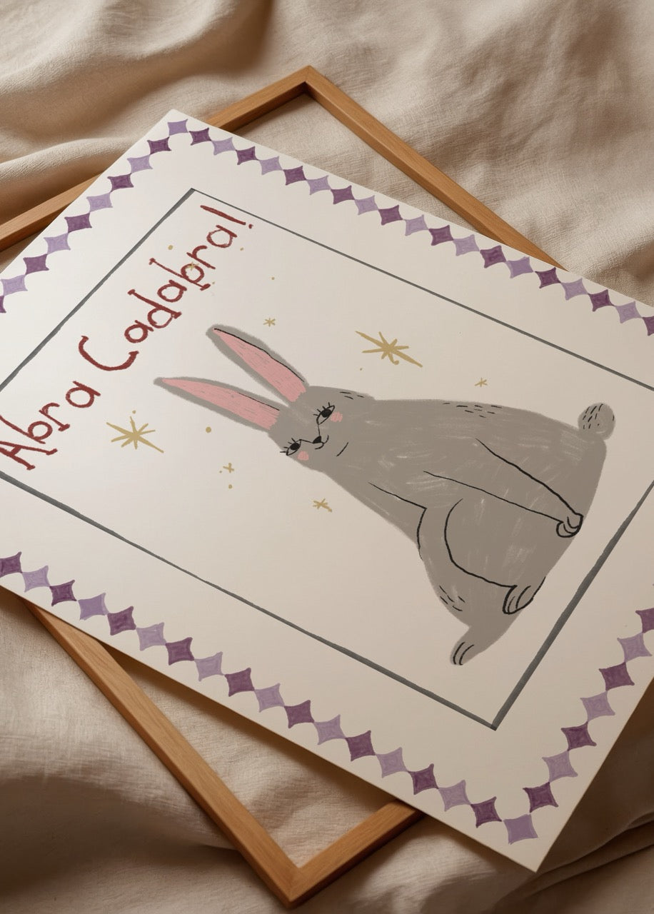 Charming grey rabbit illustration with whimsical text and decorative border.