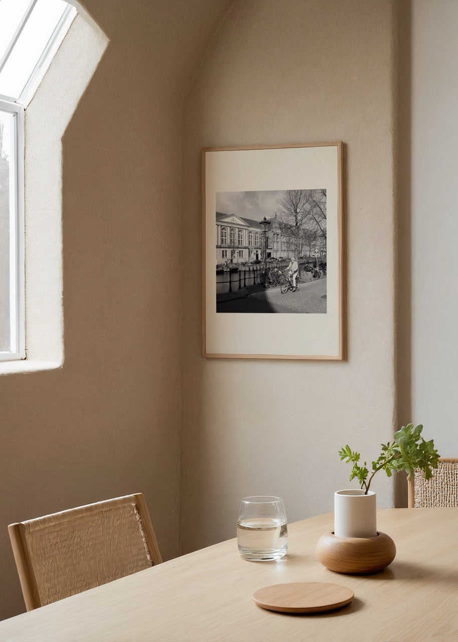 Black and white poster print of a bicycle and canal in Amsterdam.