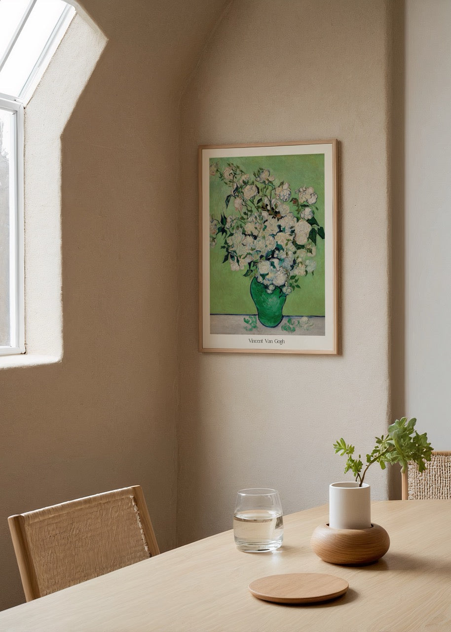 Art print of white flowers in a green vase against a green background.