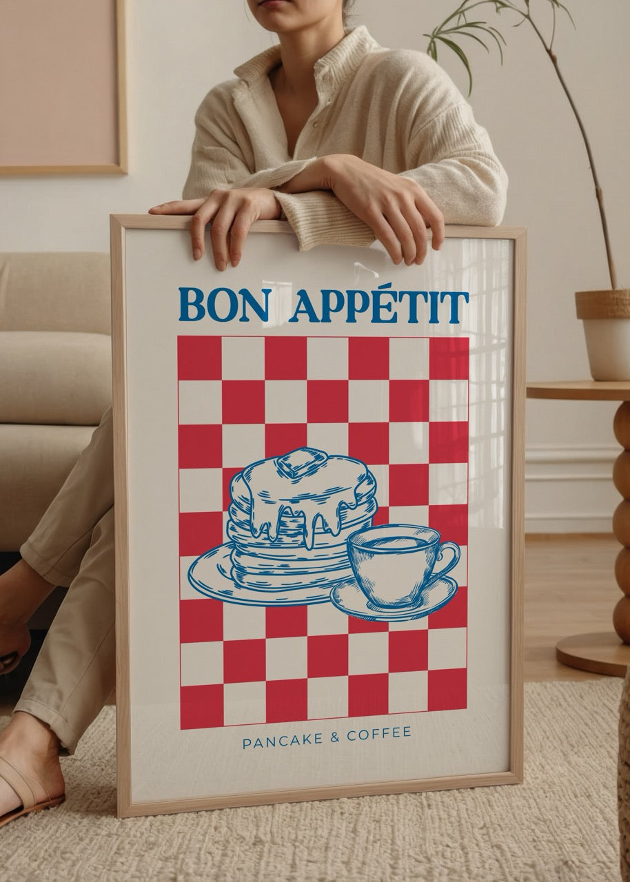 A vibrant poster print featuring pancakes and coffee on a red and white checkered background.