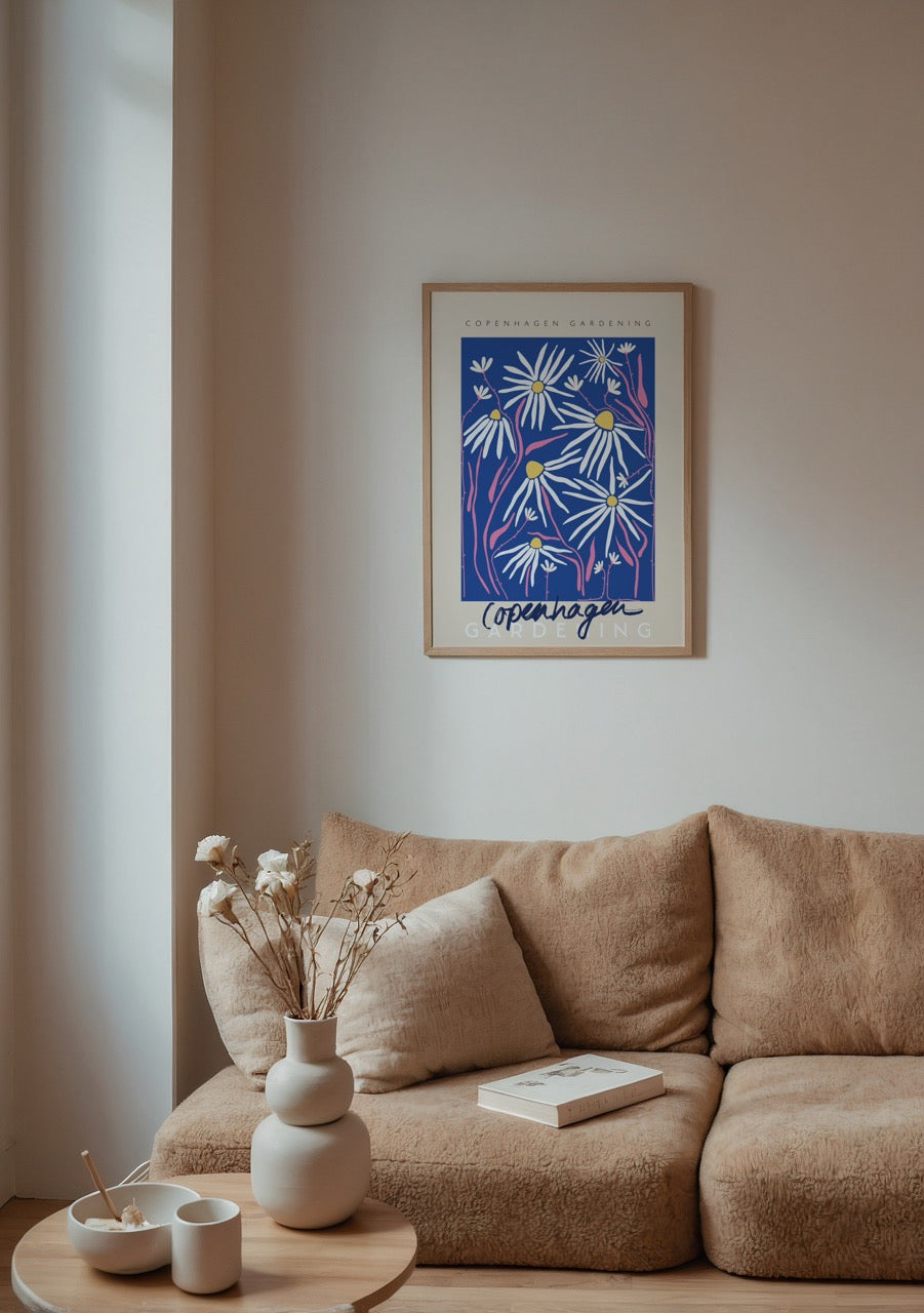 Bright floral wall art featuring daisies with a blue background, perfect for home decor.