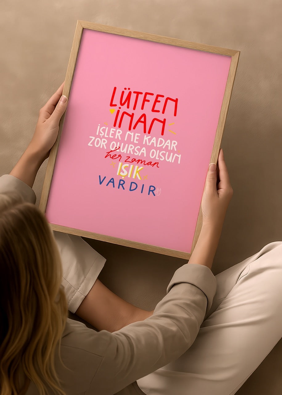 Vibrant poster print with motivational typography on a pink background.