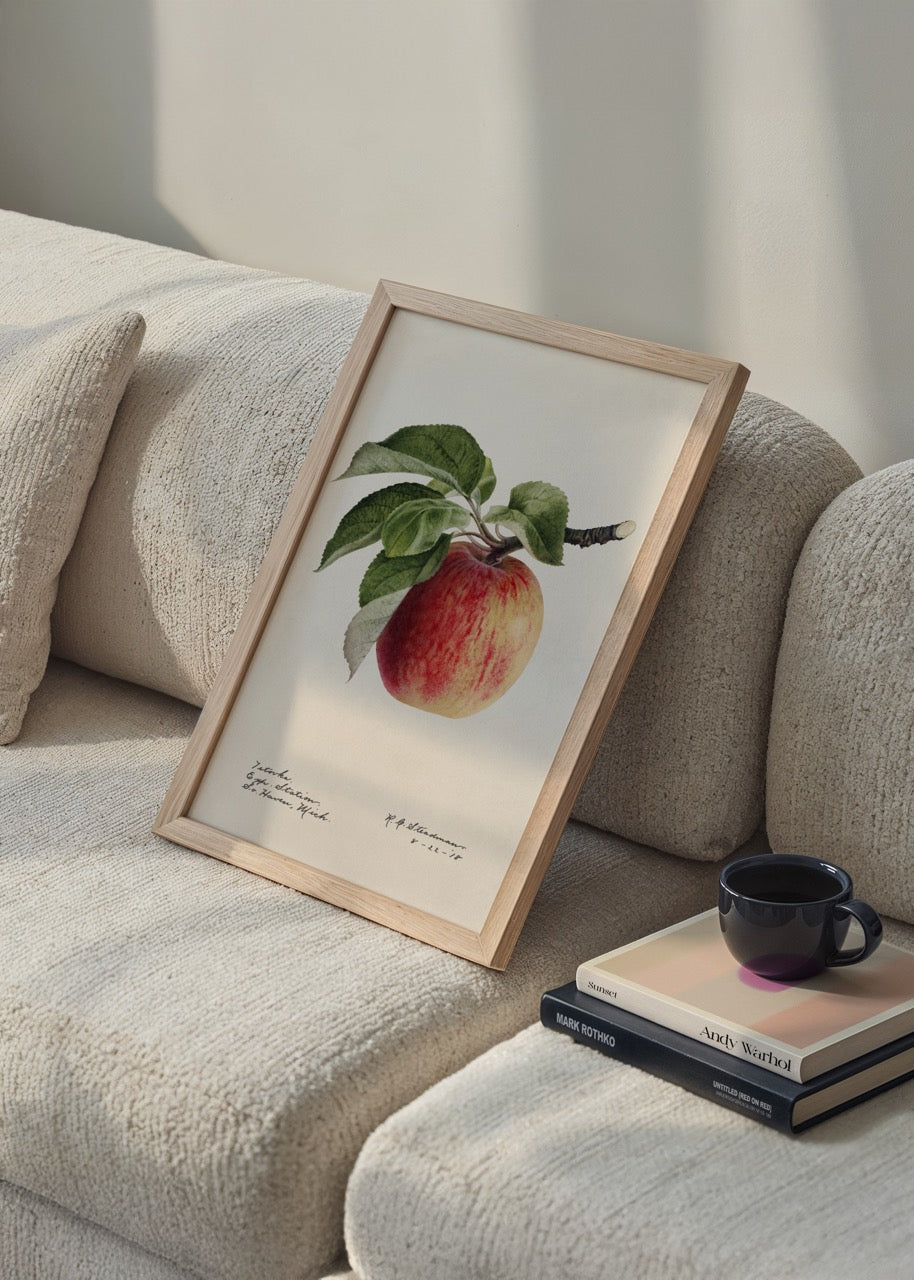 Illustration of a ripe apple with green leaves on a beige background.