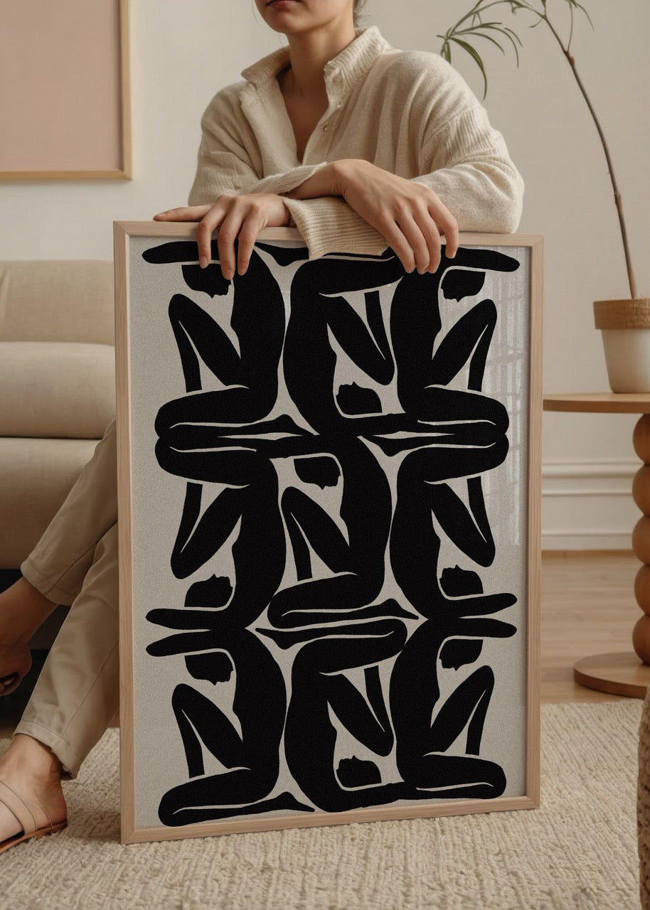 Geometric wall art featuring abstract black silhouettes in a modern design.