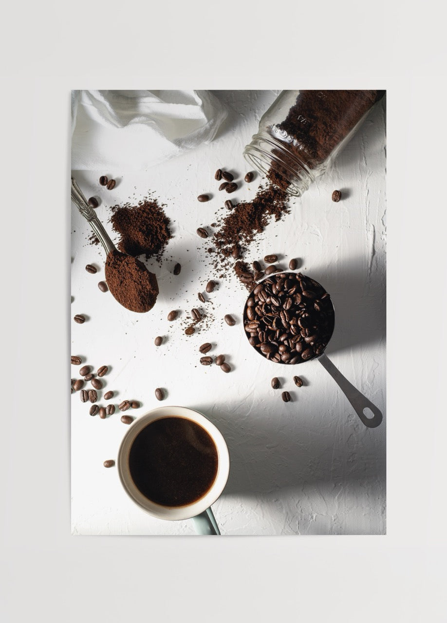 Artistic print depicting coffee preparation with beans and cup.
