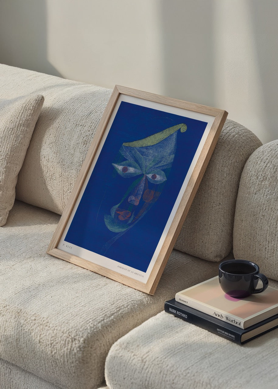 Abstract portrait artwork featuring a mystical visage in blue tones.