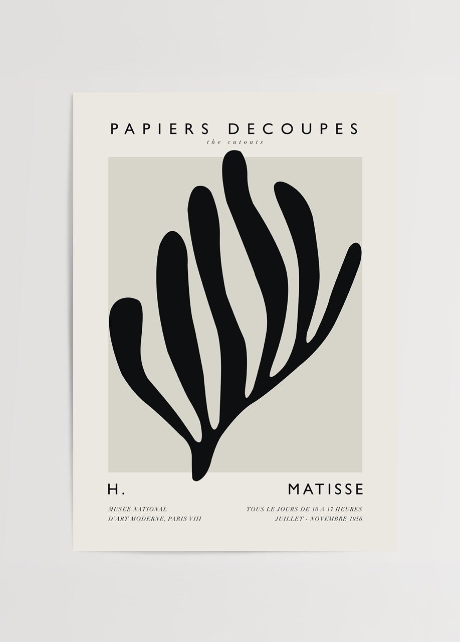 A bold cut-out design artwork featuring organic shapes in black.