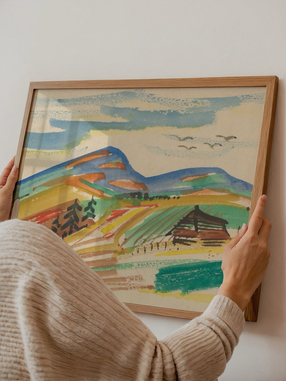 A vibrant landscape poster depicting rolling hills and a cabin, ideal for serene interior decor.