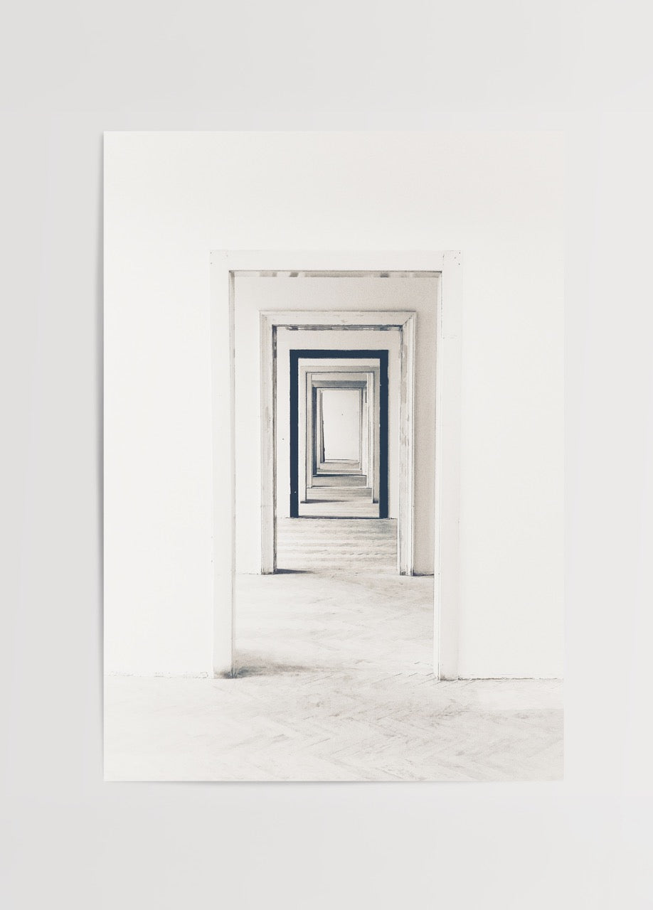 A minimalist black and white print depicting endless doorways.