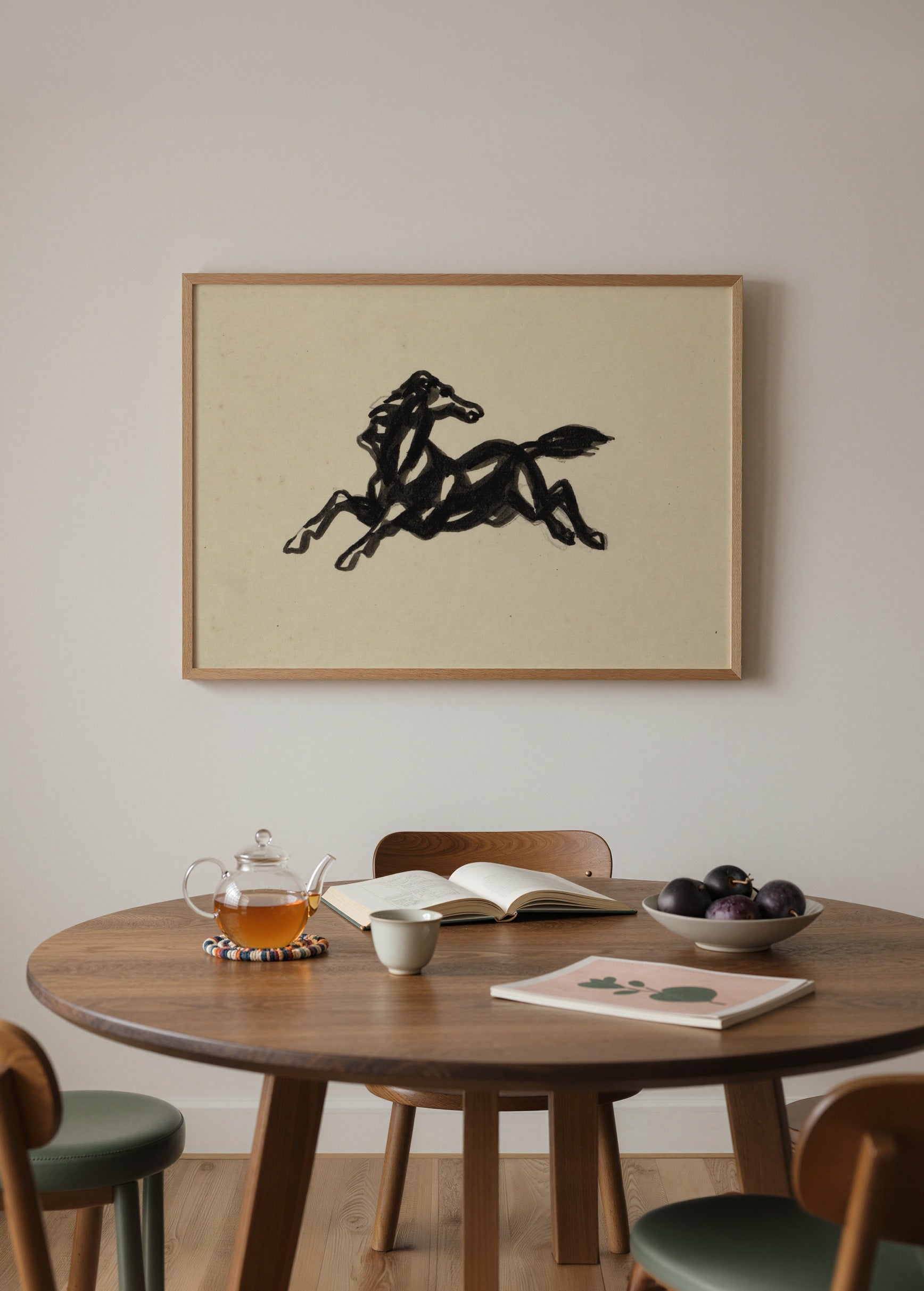 A dynamic black silhouette of a galloping horse on beige background.