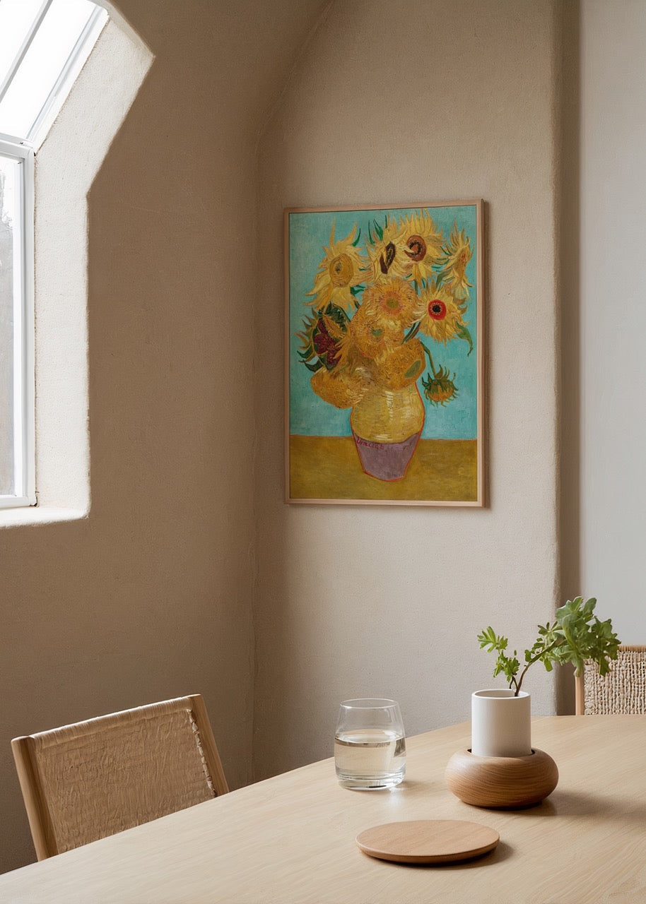 Vibrant sunflowers in a vase against a turquoise background