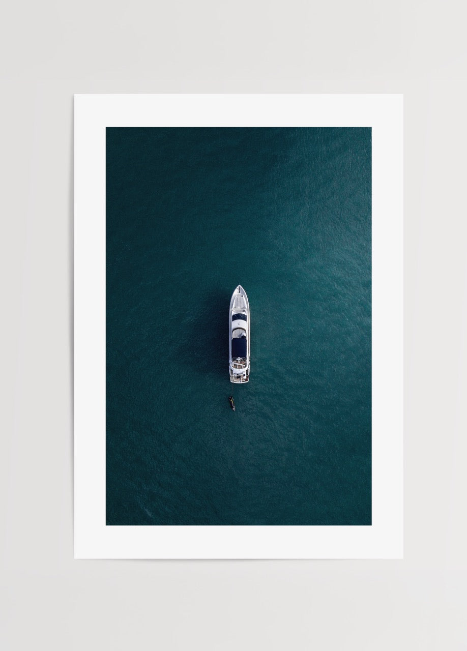 A minimalist art print of a solitary boat on tranquil blue waters.