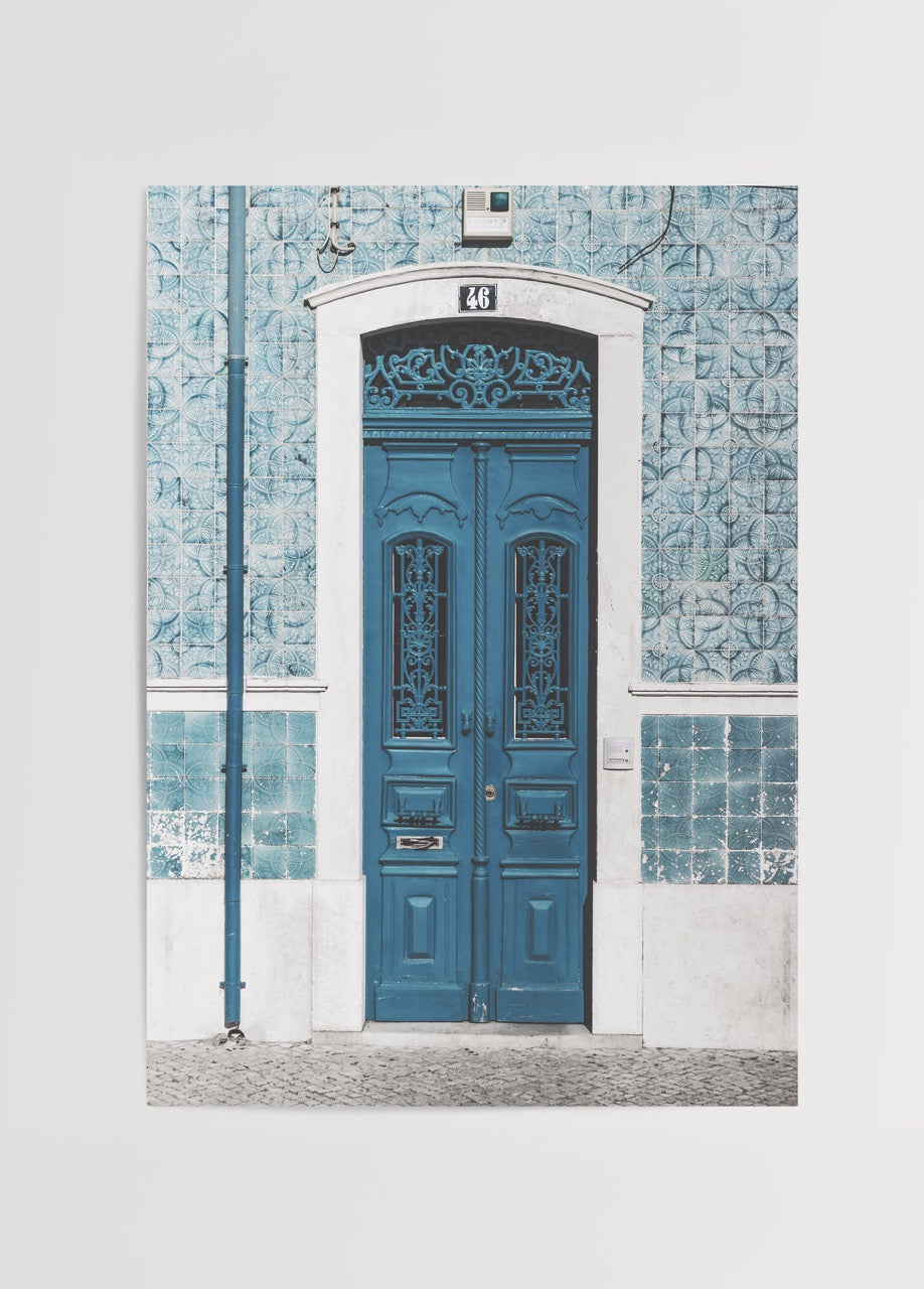Mediterranean turquoise doorway framed by ceramic tiles