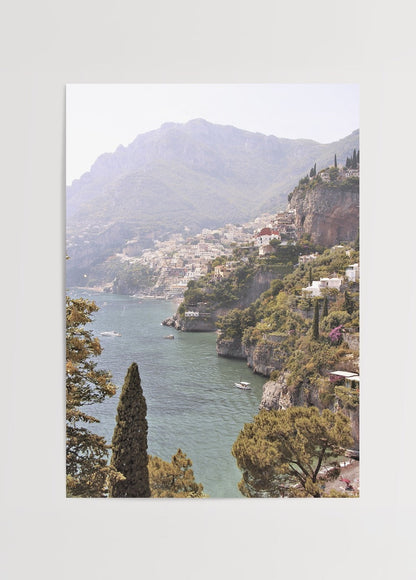 A serene landscape of the Amalfi Coast featuring lush greenery and tranquil waters.