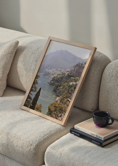 A serene landscape of the Amalfi Coast featuring lush greenery and tranquil waters.