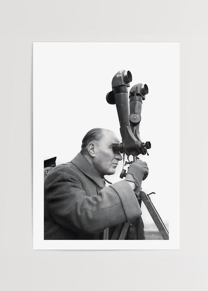 A thoughtful figure gazing through a telescope, capturing a moment of vision.