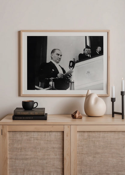 A historic black and white print capturing a moment of leadership during an address.