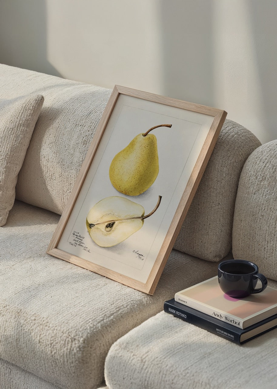 Illustrative wall art print of a golden pear and sliced pear.