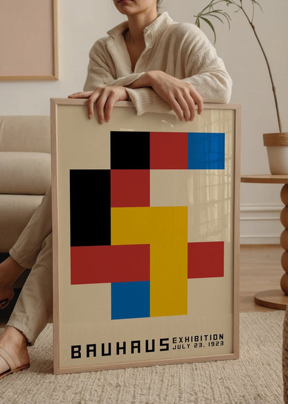 Geometric Bauhaus Exhibition poster featuring bold blocks of colour.