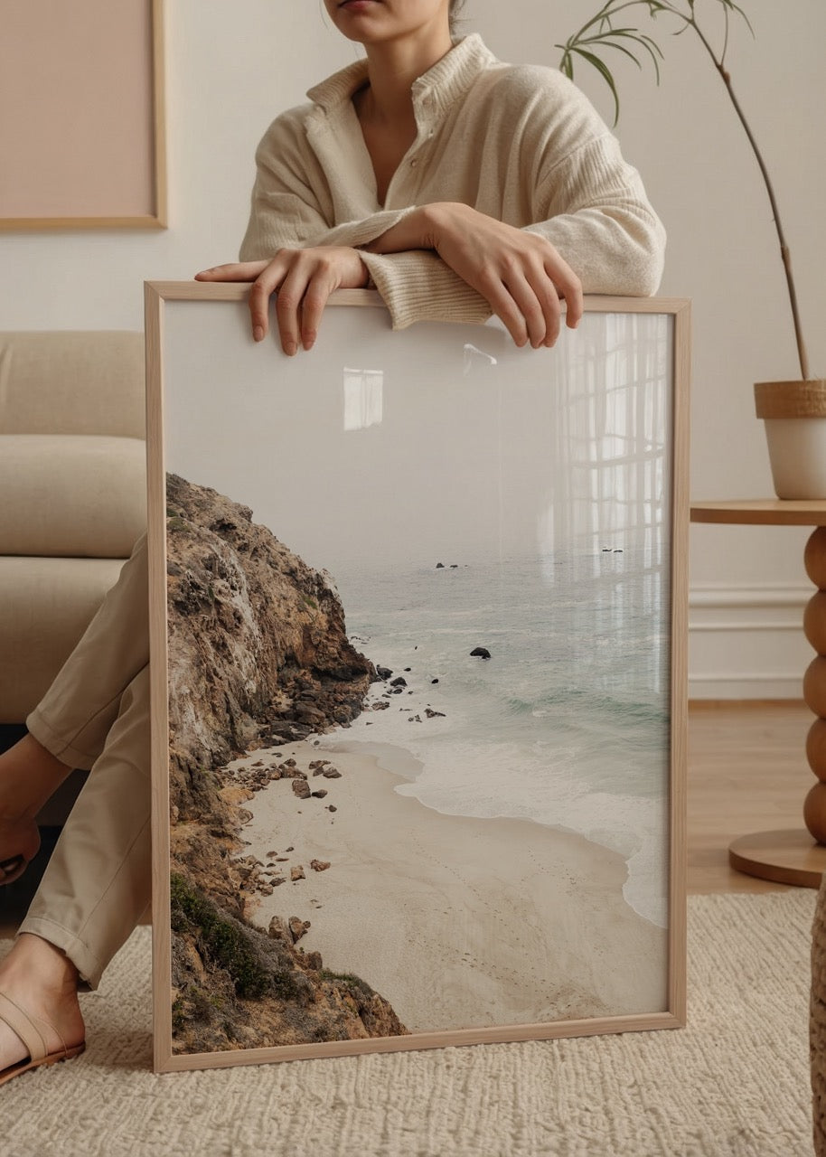 A serene beach view with gentle waves and soft sand.