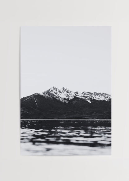 Monochrome artwork of mountains and lake reflecting calm waters