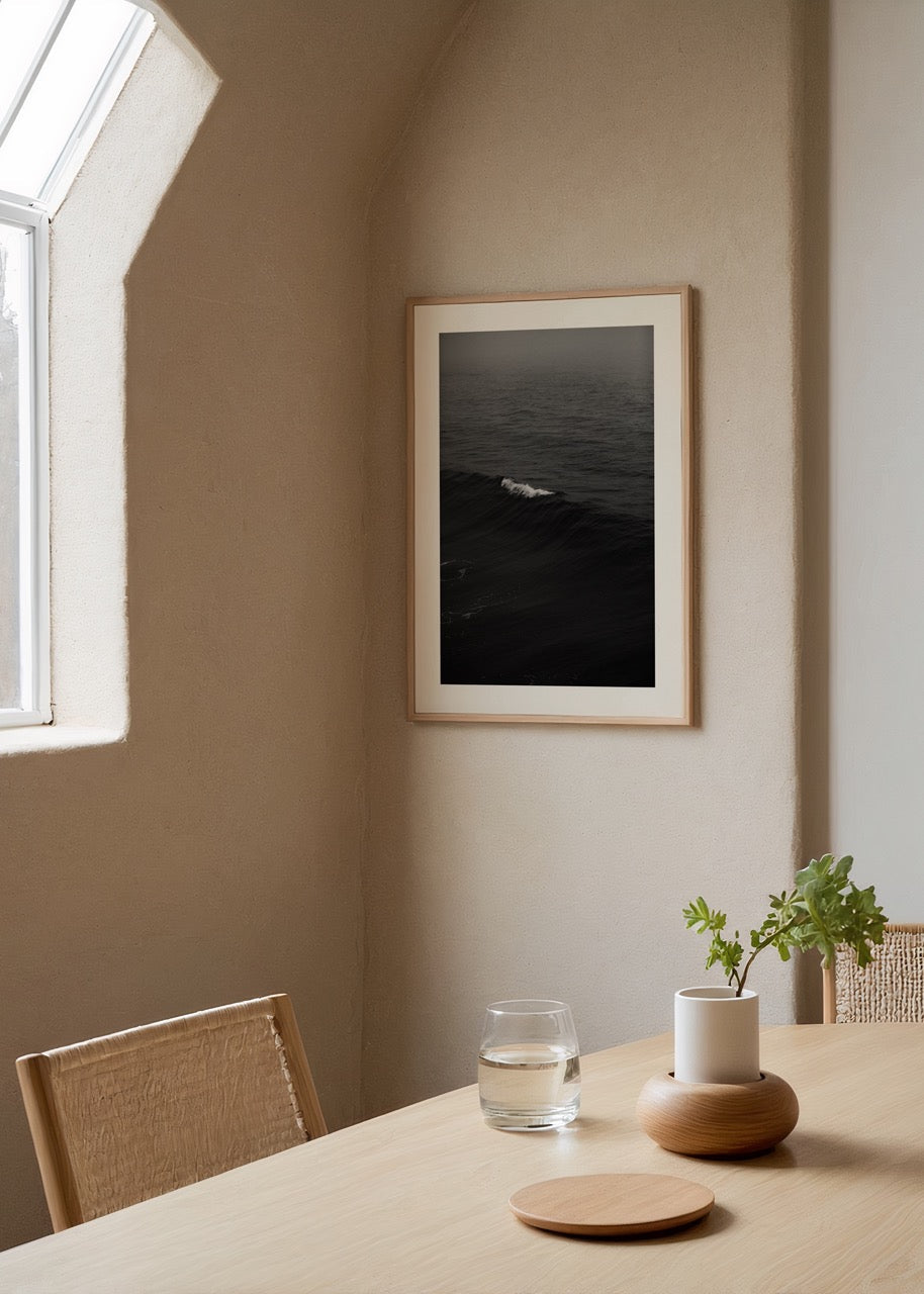 Black and white photography of ocean waves, evoking calmness and elegance.