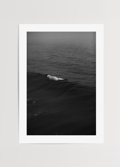 Black and white photography of ocean waves, evoking calmness and elegance.