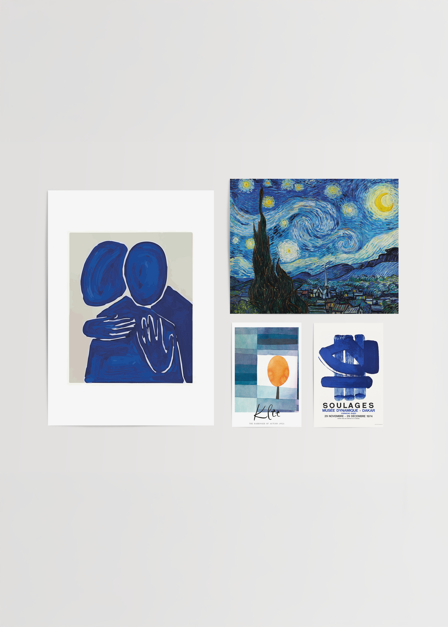A collection of blue-themed wall art including abstract figures and landscapes.