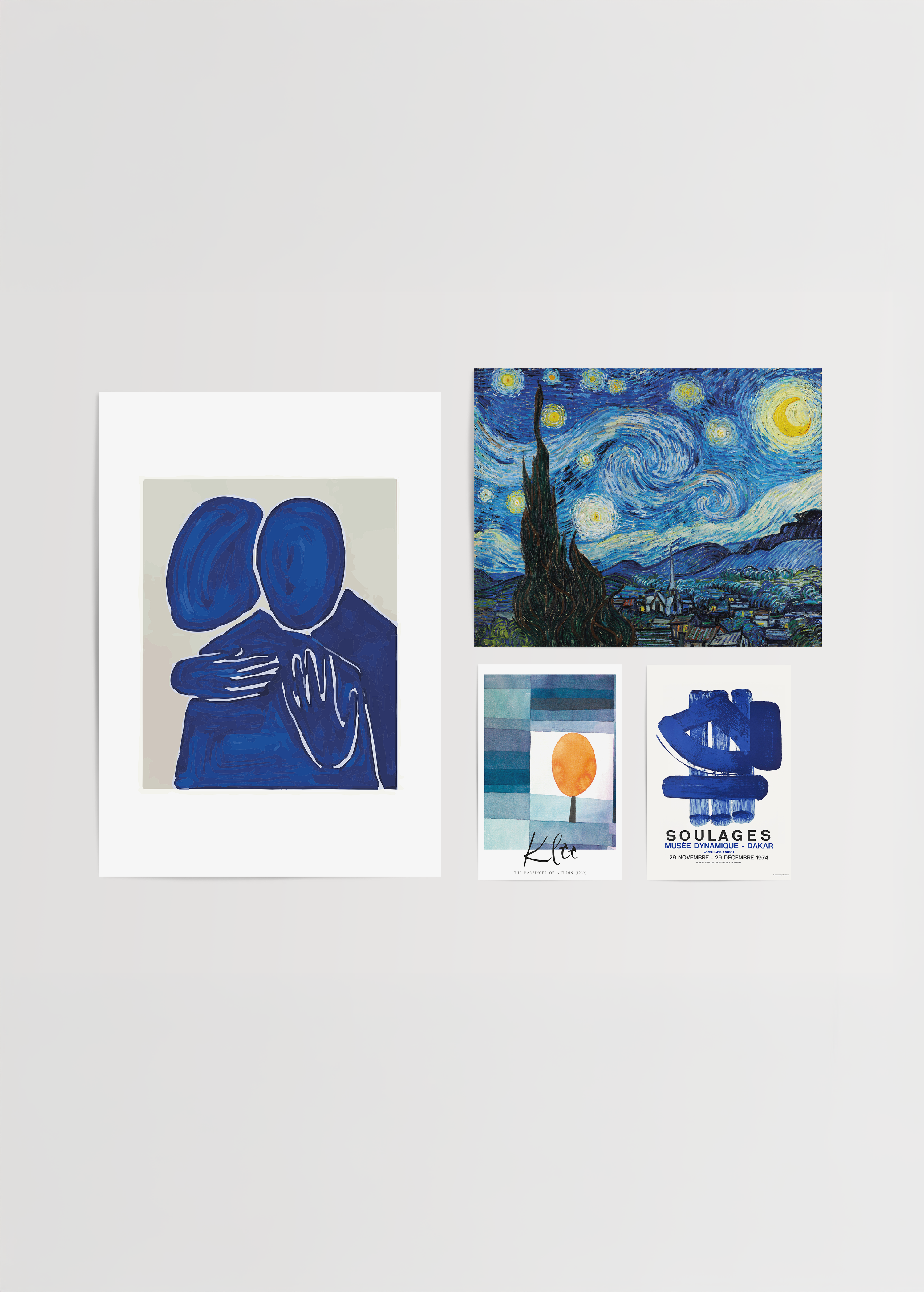 A collection of blue-themed wall art including abstract figures and landscapes.