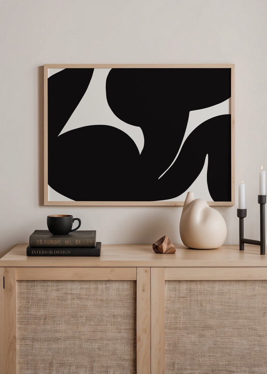 Dynamic black and white abstract wall art featuring bold silhouettes.