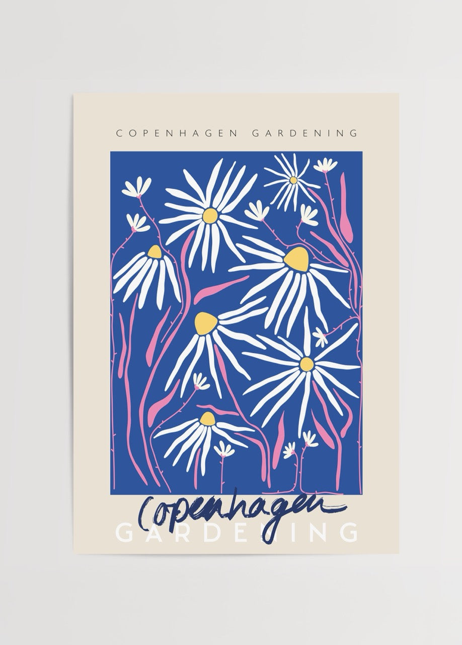 Bright floral wall art featuring daisies with a blue background, perfect for home decor.