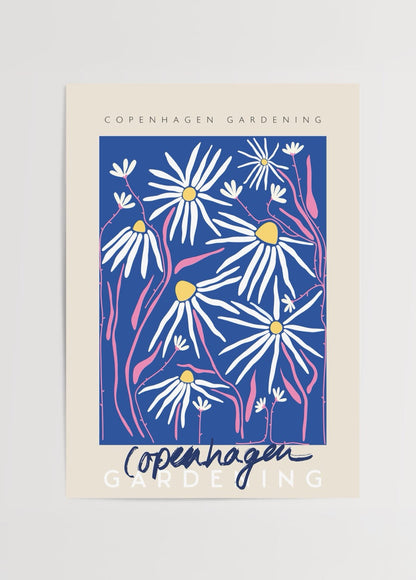 Bright floral wall art featuring daisies with a blue background, perfect for home decor.