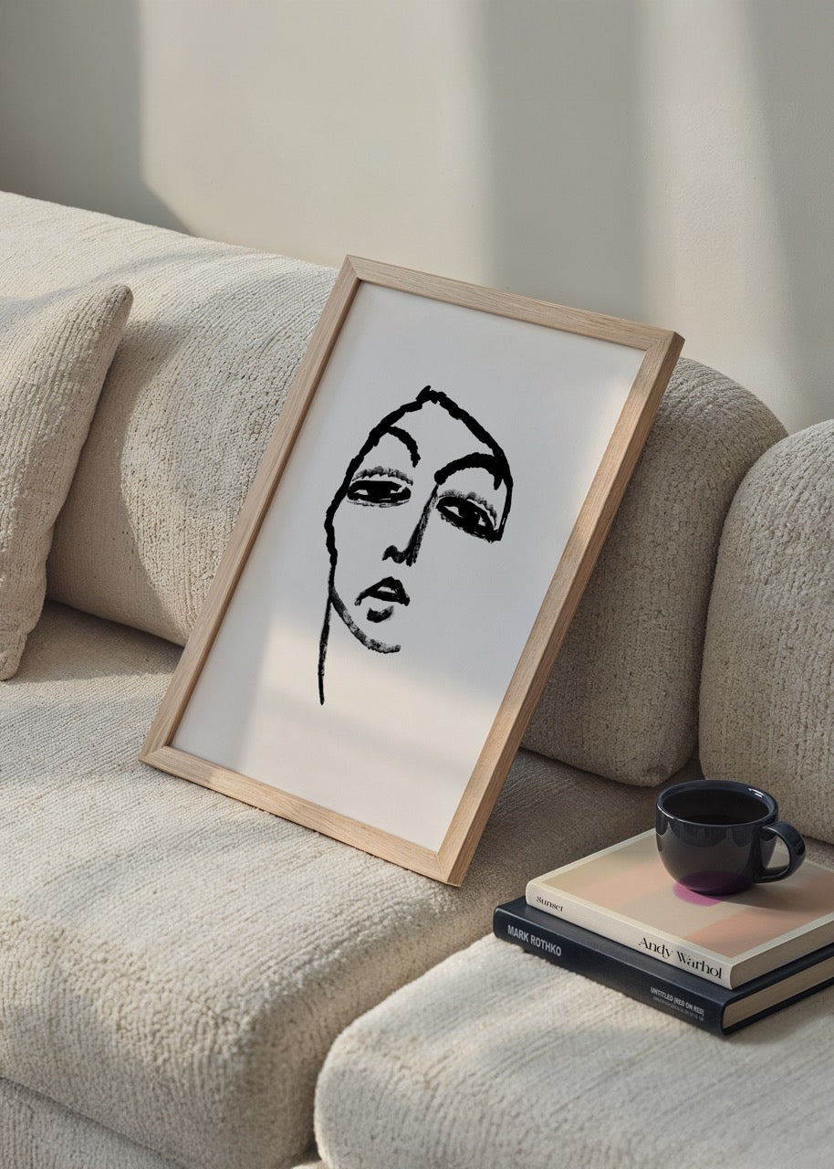 Monochrome line art print featuring an emotive face in black and white.