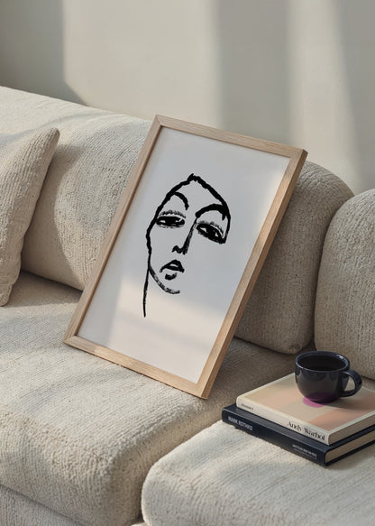Monochrome line art print featuring an emotive face in black and white.