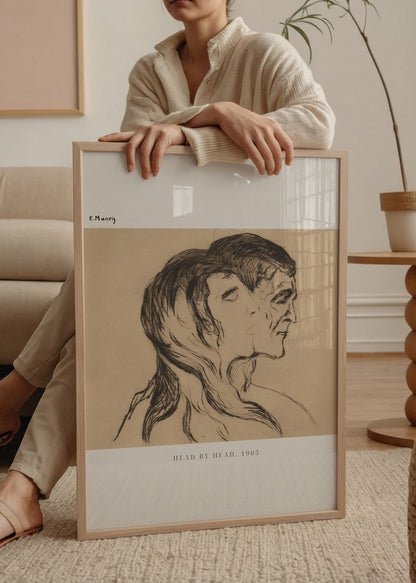 Art print depicting two intertwined faces exploring emotional duality.