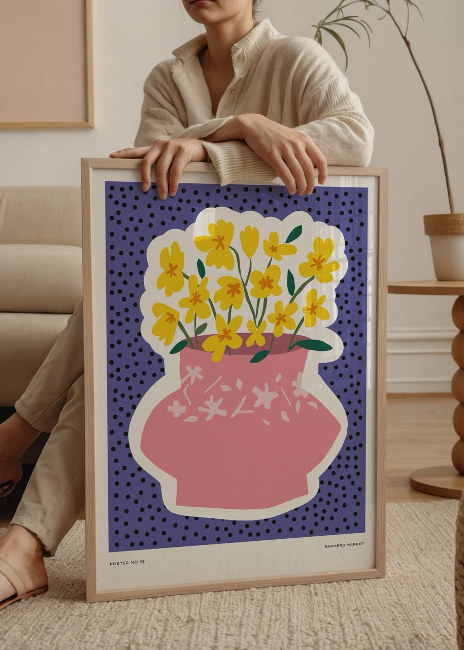 Vibrant floral wall art featuring a pink vase and yellow flowers against a blue background.