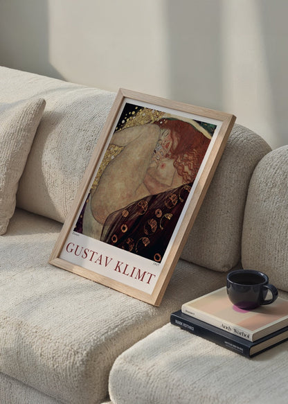 Captivating wall art featuring an intimate embrace with intricate patterns and golden hues.
