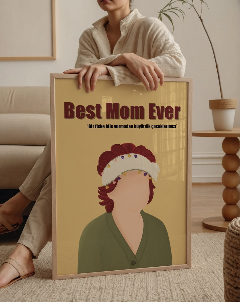 Illustrative poster print featuring a mother figure with a warm expression and vibrant colours.