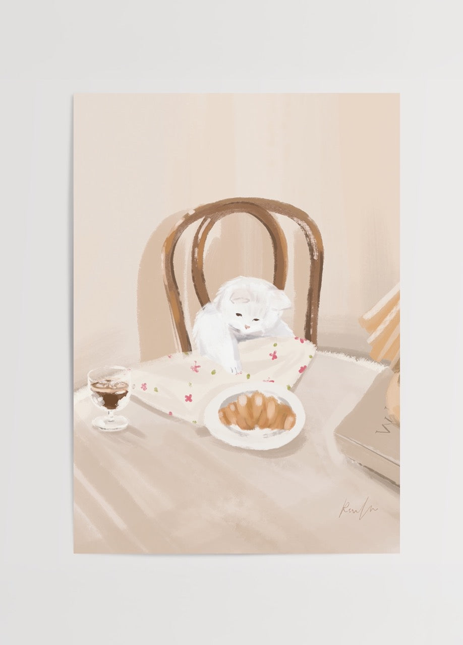 Charming illustration of a cat beside a croissant on a table, evoking warmth and comfort.