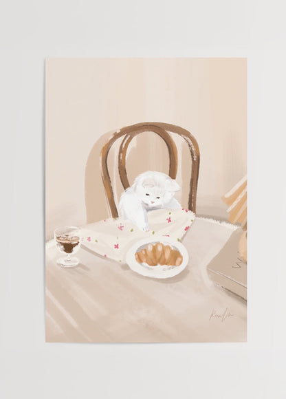 Charming illustration of a cat beside a croissant on a table, evoking warmth and comfort.