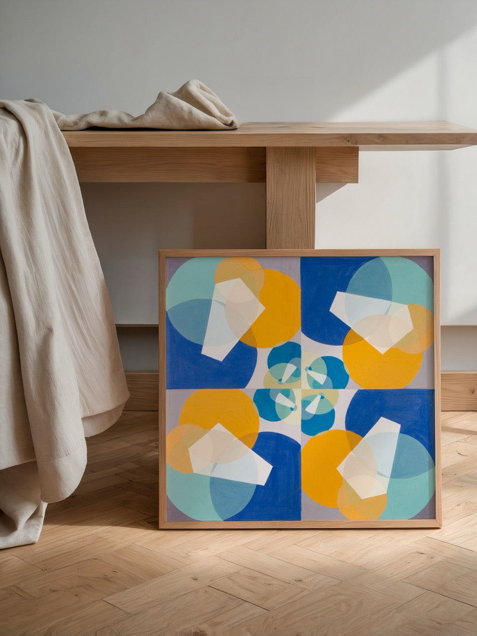 Abstract wall art featuring vibrant geometric shapes in blue, yellow, and soft neutrals.
