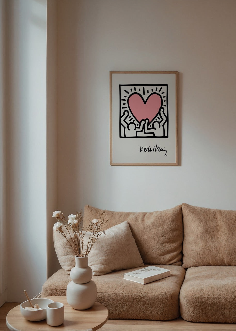 An illustrative wall art featuring a pink heart held by two figures, radiating positivity.