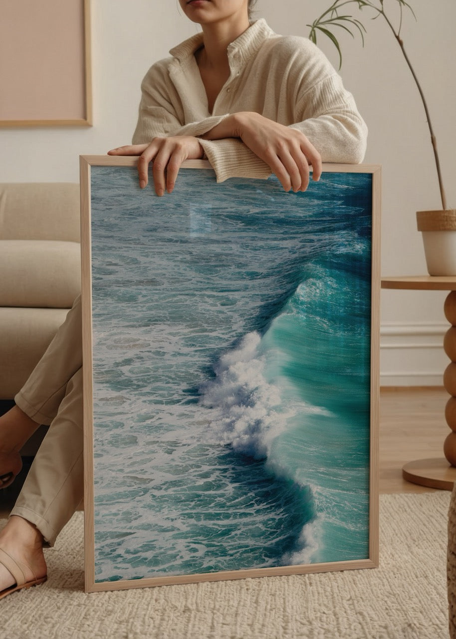A captivating wall art piece showing ocean waves meeting the shore in vibrant blue tones.