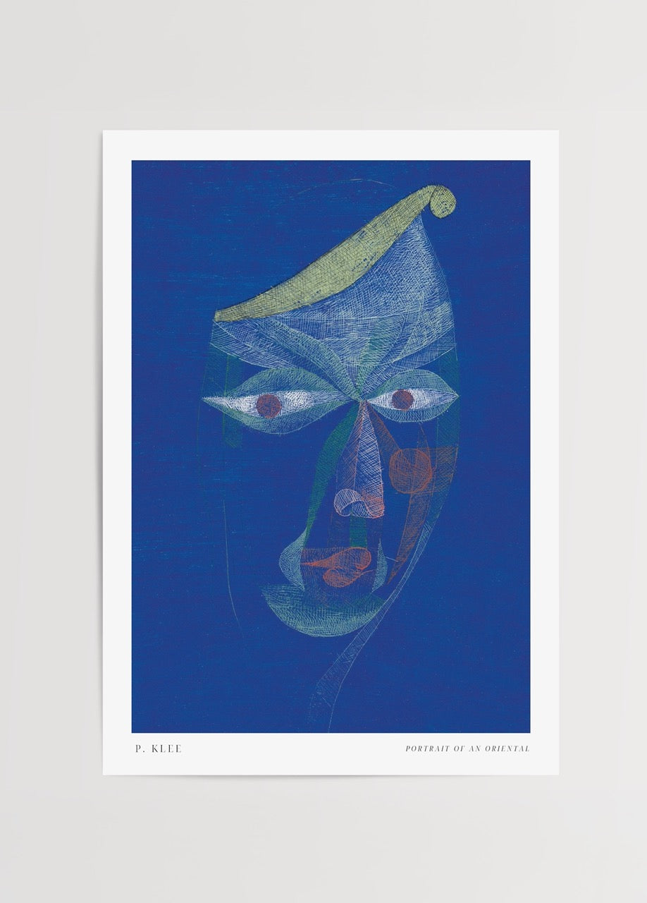 Abstract portrait artwork featuring a mystical visage in blue tones.