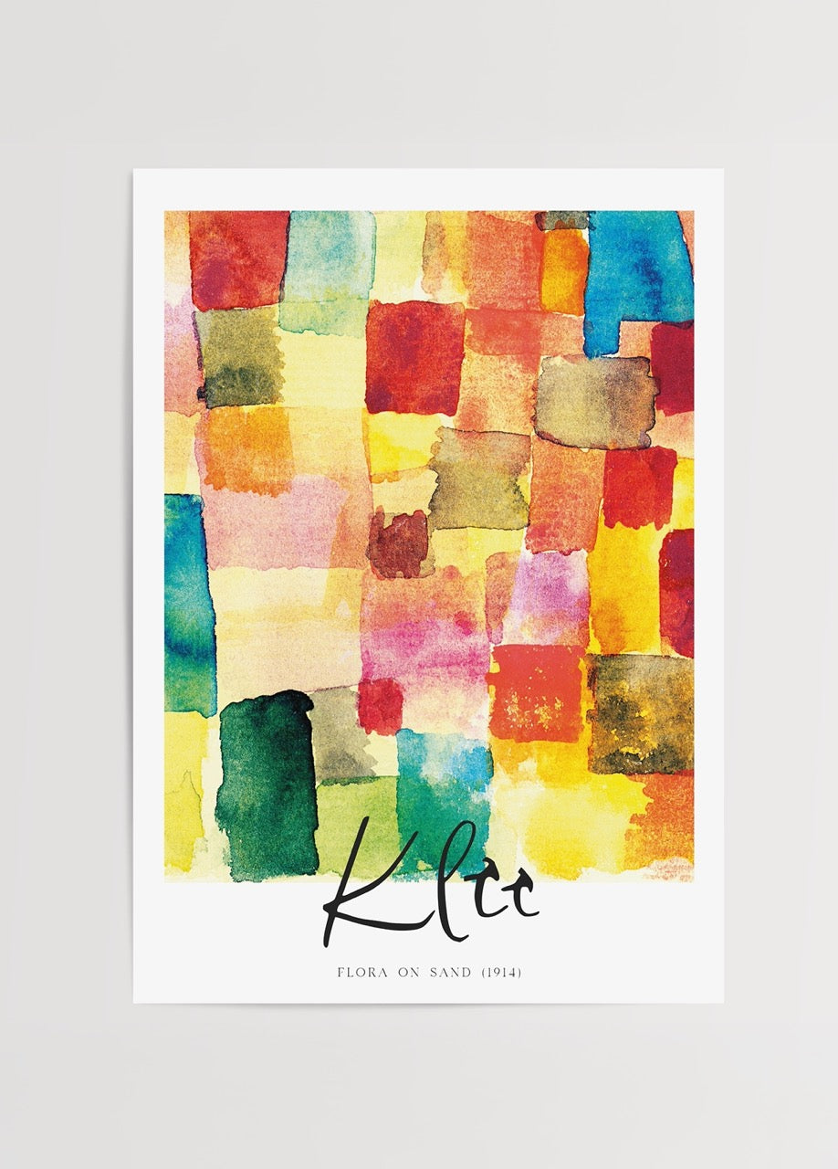 Vibrant floral mosaic artwork featuring a blend of colours on sand.