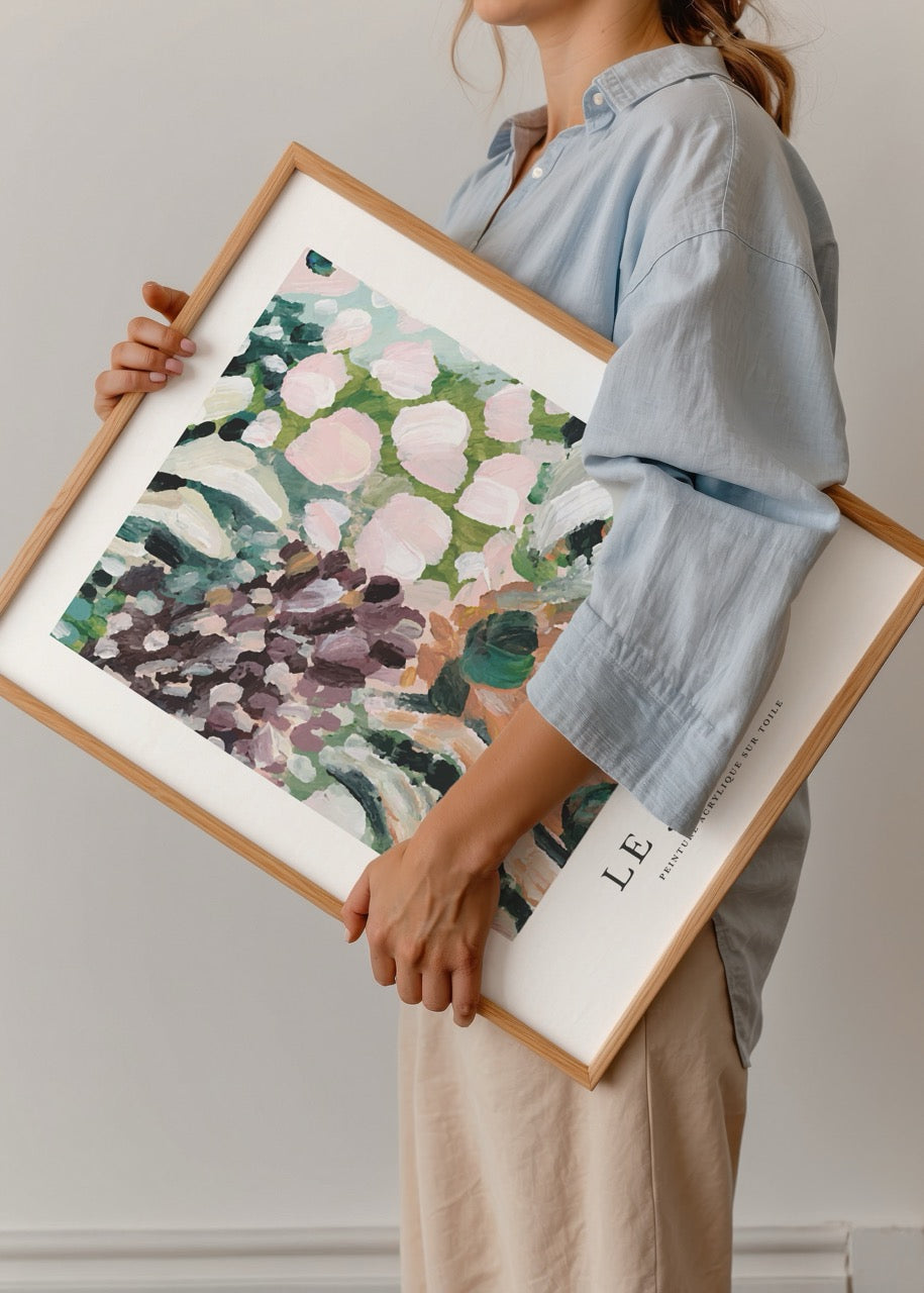Vibrant botanical wall art featuring lush green and pink foliage.