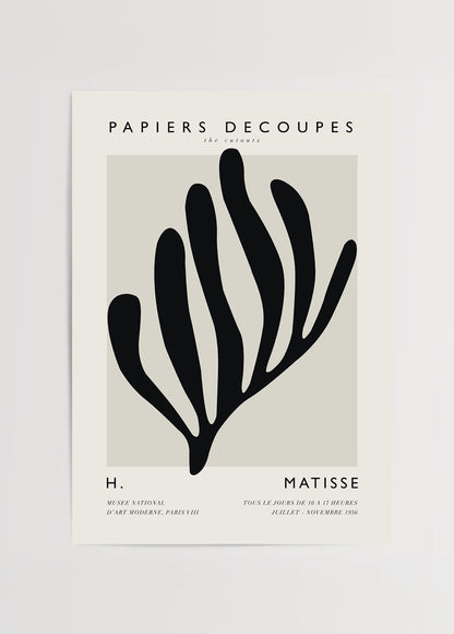 A bold cut-out design artwork featuring organic shapes in black.