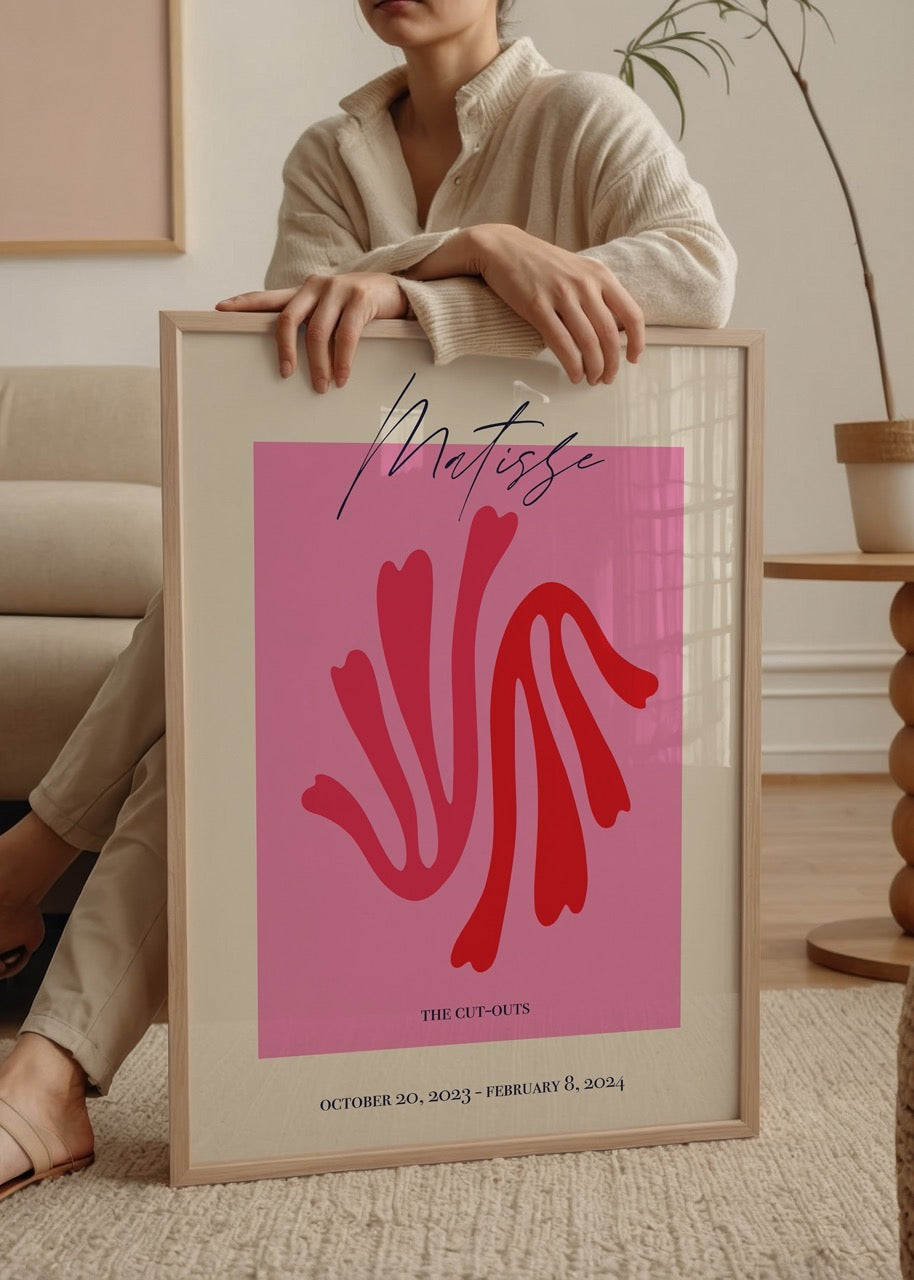 Vibrant cut-outs art poster featuring bold shapes in pink and red.