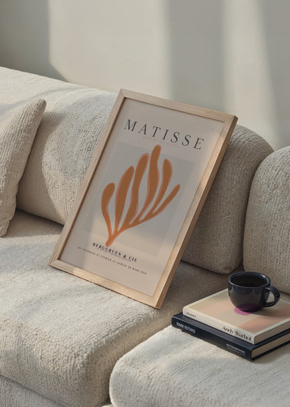 Leafy cut-out art print in warm hues for stylish decor.