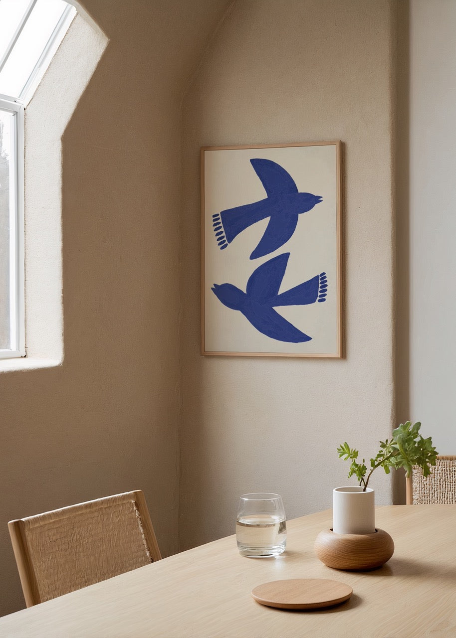 Minimalist poster featuring two blue bird silhouettes.